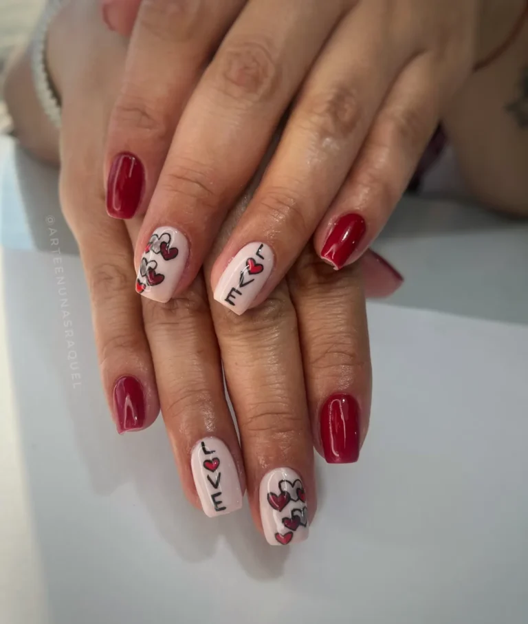 Uñas largas rojas con corazones en Arte en Uñas Raquel